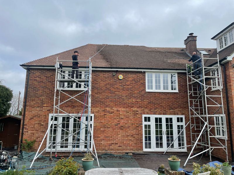 Roof cleaning carried out safely from scaffold towers by The Roof Moss Cleaners in Newbury